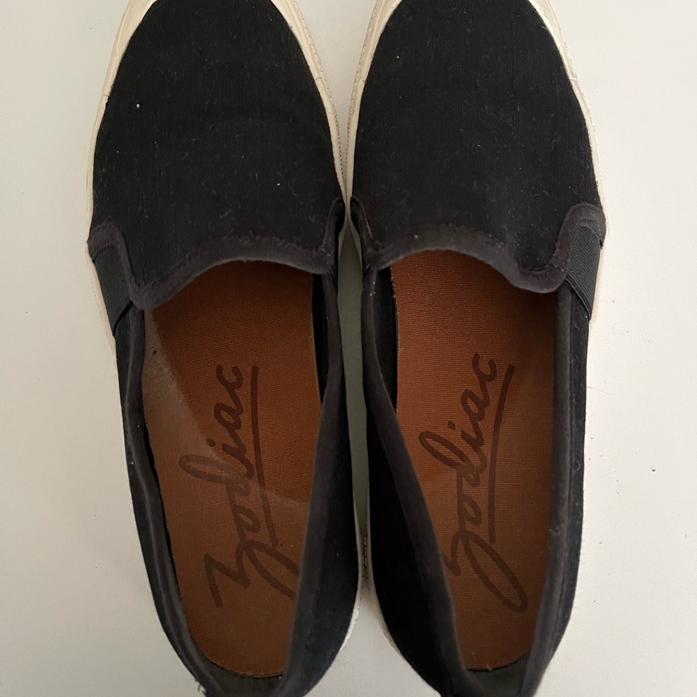 Black Canvas deck shoe sneaker slip on by Zodiac.